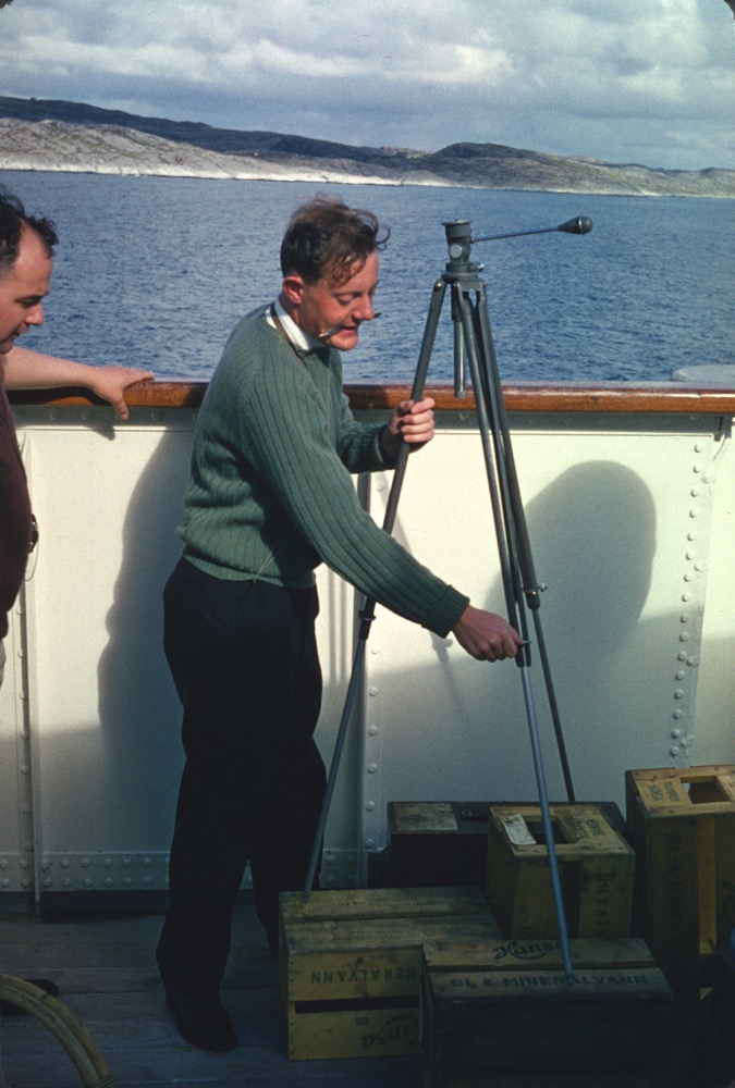Terry, the cameraman adjusts his tripod on M.V. Leda